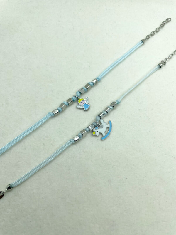 Bracciale bambino celeste cordino con pendente smaltato