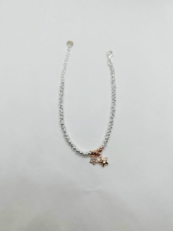 Bracciale bicolore stelle pendenti